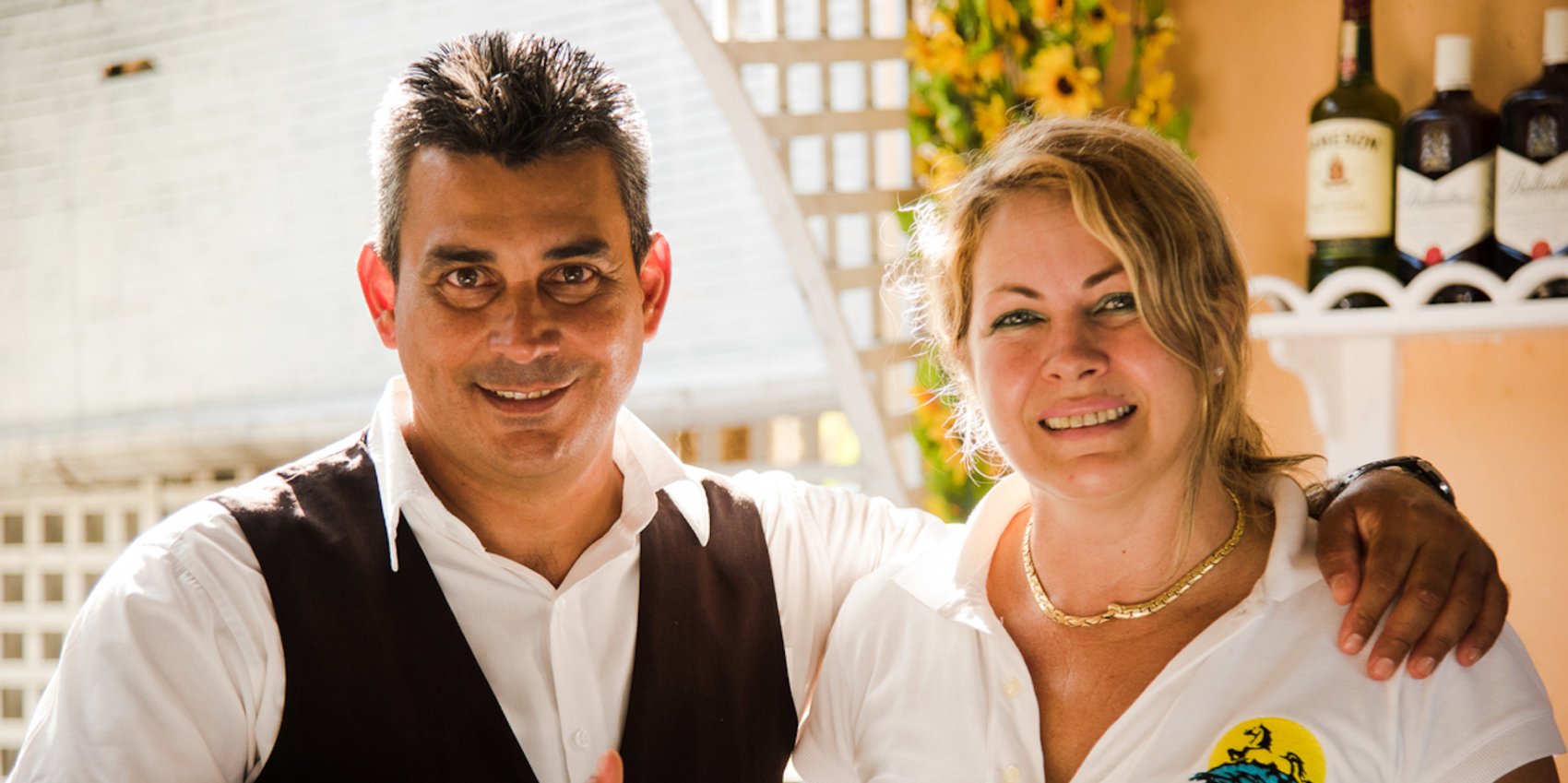 Two local Cubans smiling for the camera